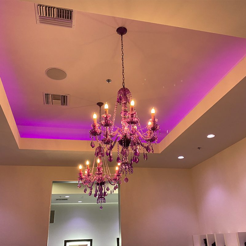 A chandelier in the middle of a room.