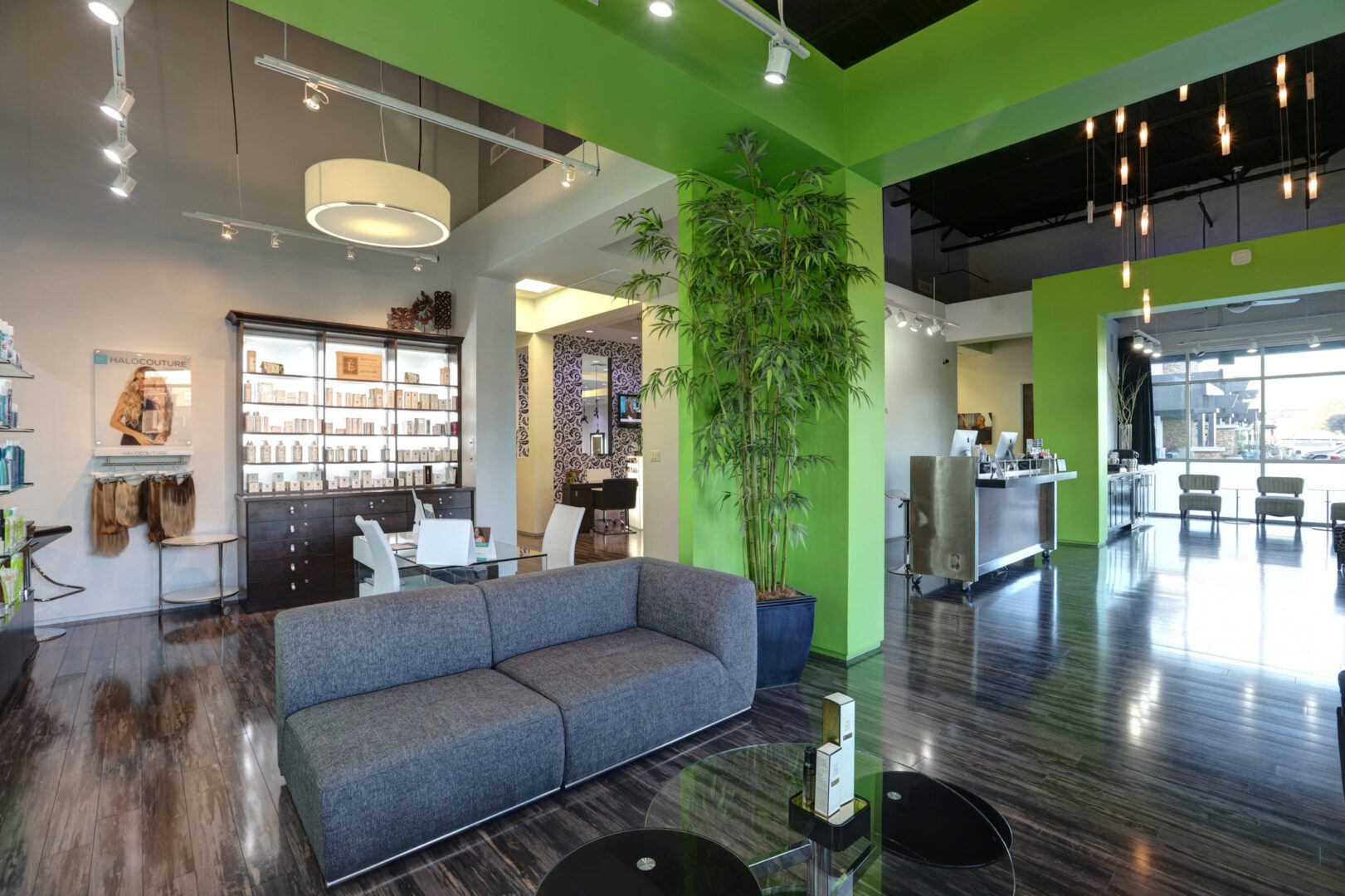 A living room filled with furniture and green walls.